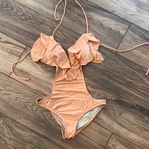 One piece swimsuit. Peach like color. Never worn.